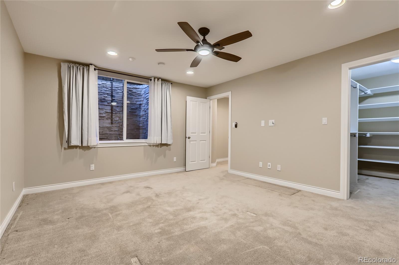 445 Jackson Street Denver, CO 80206 - Photo 22 of 29 a view of an empty room with a window