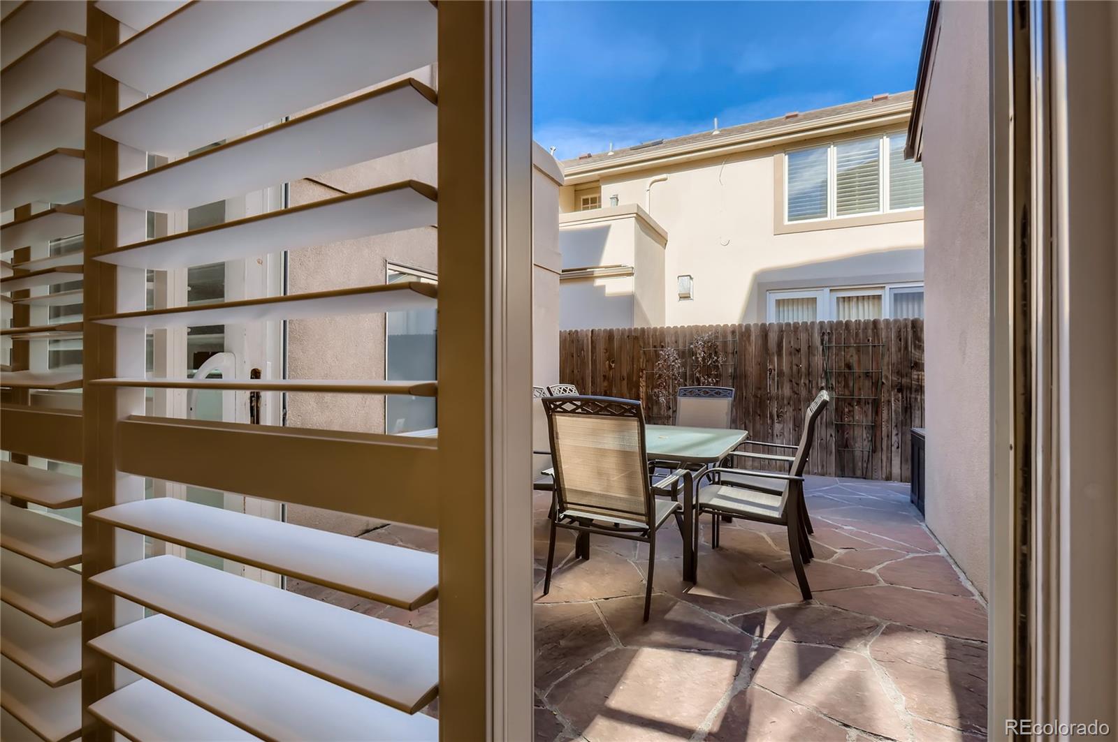 445 Jackson Street Denver, CO 80206 - Photo 27 of 29 a balcony with wooden floor and furniture