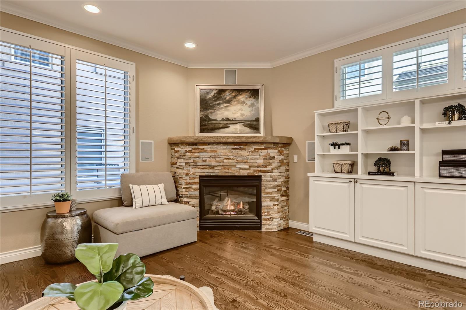 445 Jackson Street Denver, CO 80206 - Photo 3 of 29 a living room with furniture and a fireplace