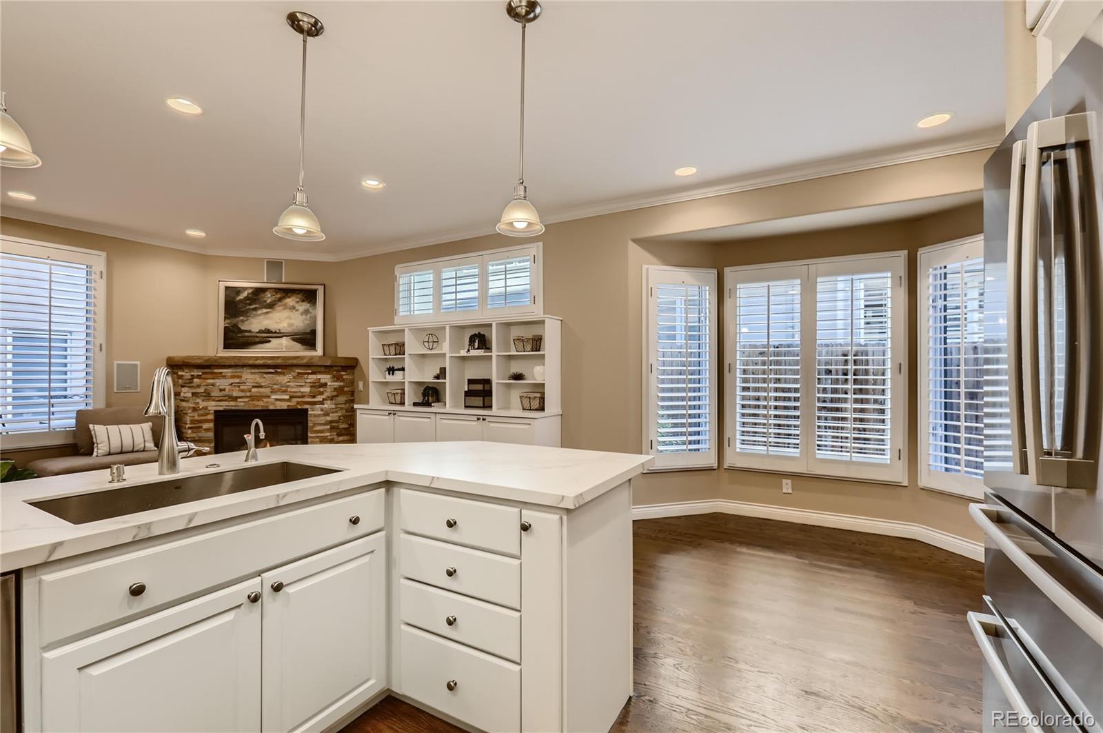 445 Jackson Street Denver, CO 80206 - Photo 8 of 29 a kitchen with a refrigerator oven and a sink