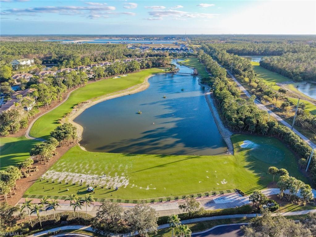 3653 Periwinkle Way, Unit 127 Naples, FL 34114 - Photo 33 of 44 an aerial view of residential houses with outdoor space