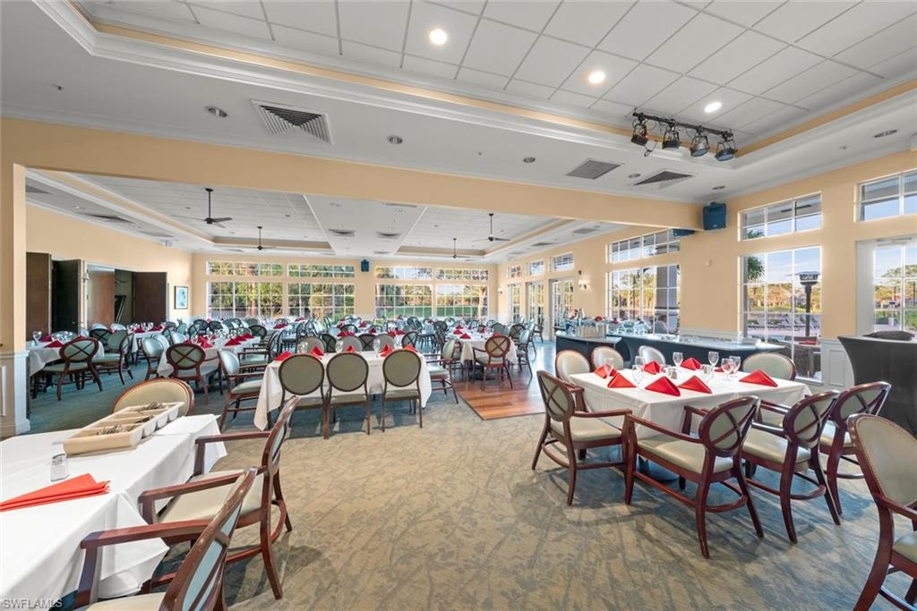 3653 Periwinkle Way, Unit 127 Naples, FL 34114 - Photo 42 of 44 a outdoor space with lots of tables and chairs