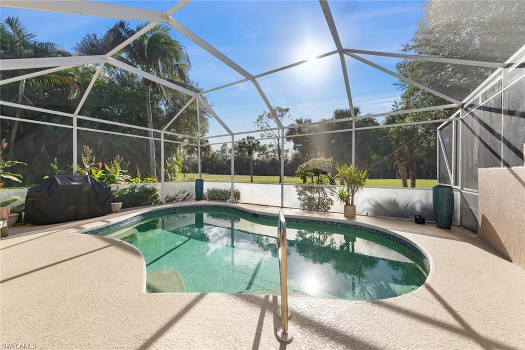3653 Periwinkle Way, Unit 127 Naples, FL 34114 - Photo 7 of 44 a view of a swimming pool with a porch