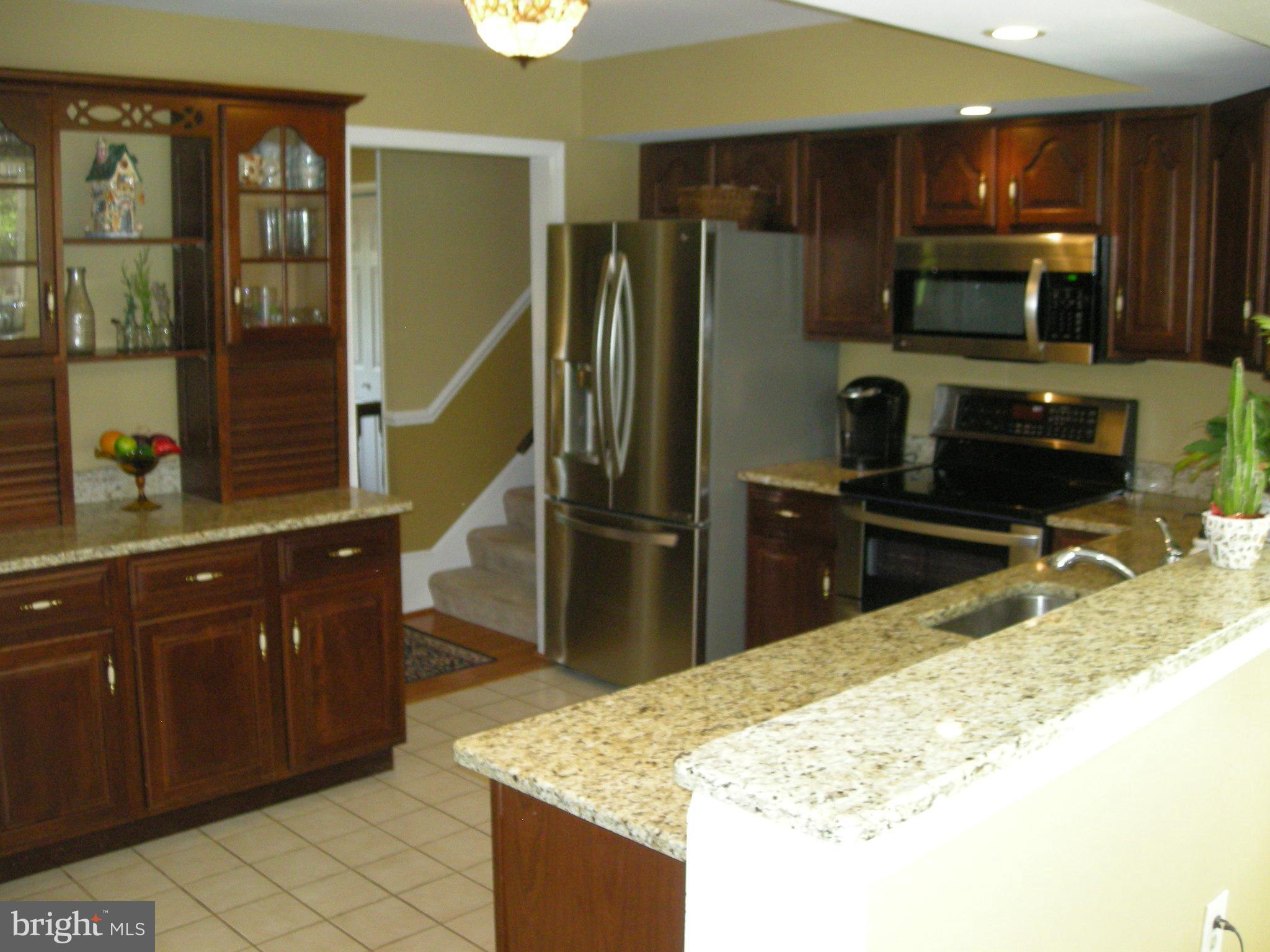 2208 Brookhaven Court Fallston, MD 21047 - Photo 10 of 30 A half wall joins the cook/ the rest of crowd.