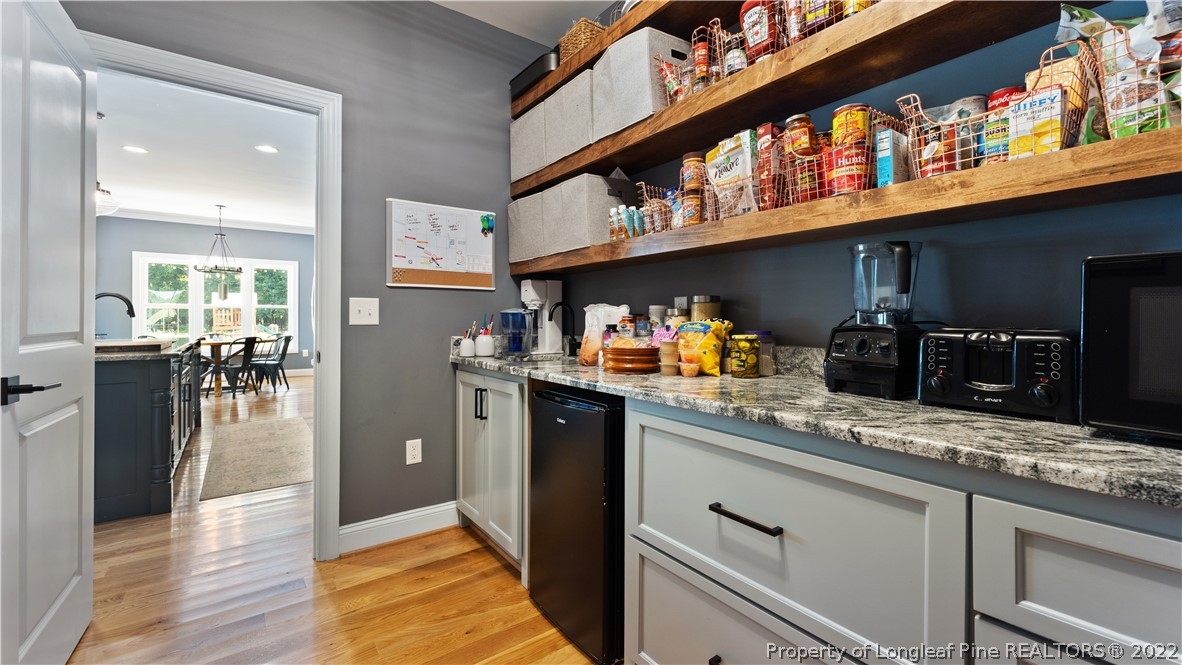 430 Mingo Church Road Dunn, NC 28334 - Photo 20 of 48 a kitchen with stainless steel appliances granite countertop a lot of cabinets