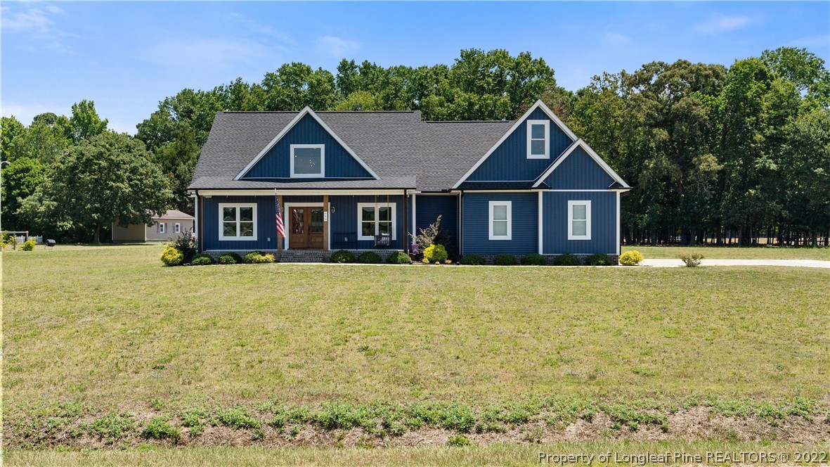 430 Mingo Church Road Dunn, NC 28334 - Photo 2 of 48 a house view with a garden space