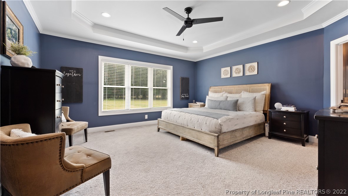 430 Mingo Church Road Dunn, NC 28334 - Photo 24 of 48 a bedroom with a bed and a flat screen tv