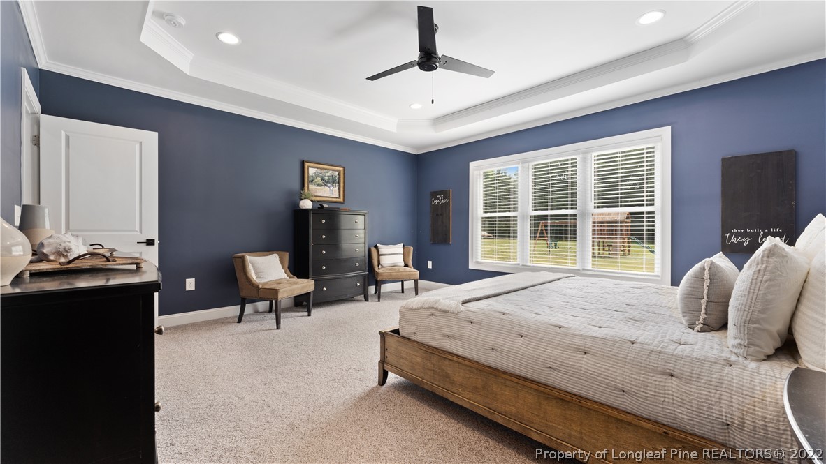 430 Mingo Church Road Dunn, NC 28334 - Photo 27 of 48 a bedroom with a bed and wooden floor