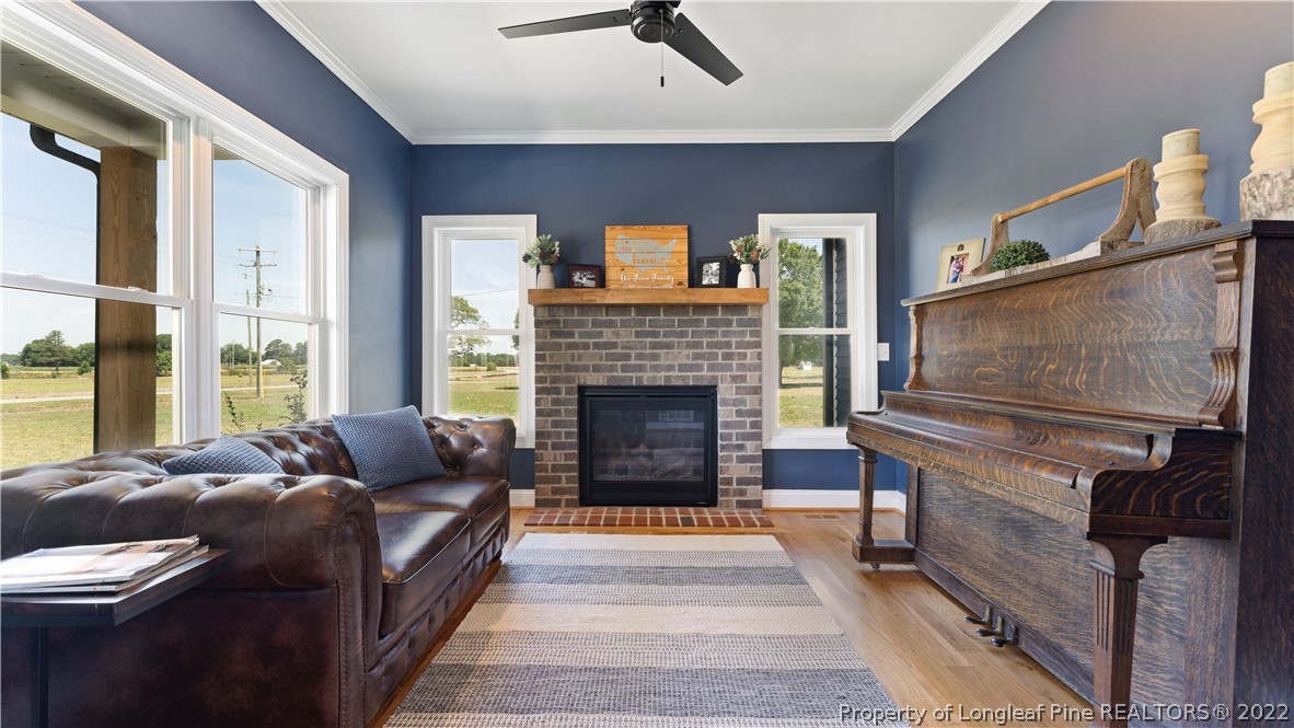 430 Mingo Church Road Dunn, NC 28334 - Photo 33 of 48 a living room with furniture and a fireplace