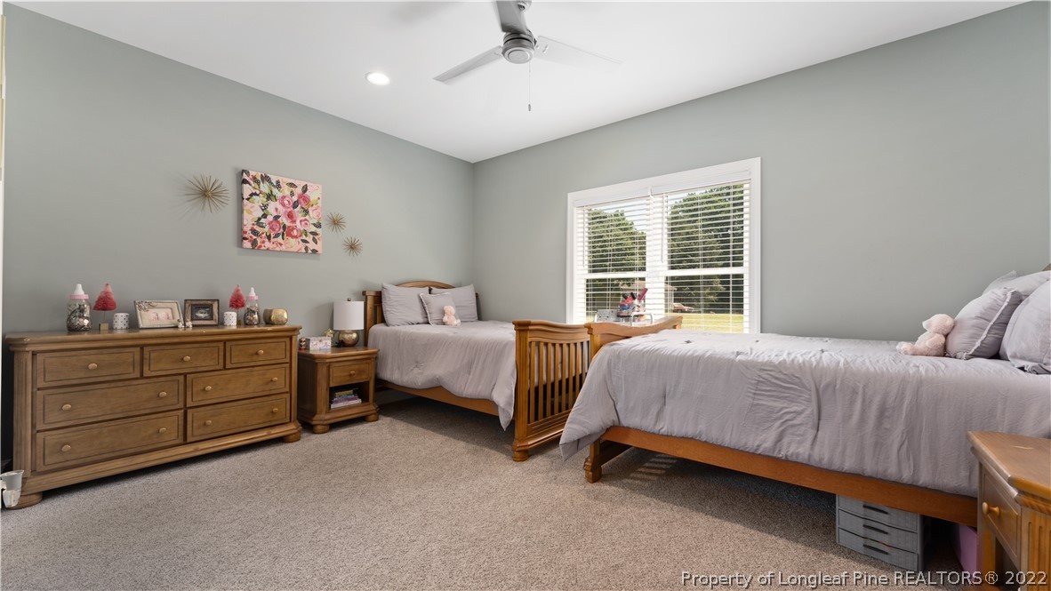 430 Mingo Church Road Dunn, NC 28334 - Photo 35 of 48 a bedroom with a bed and a window