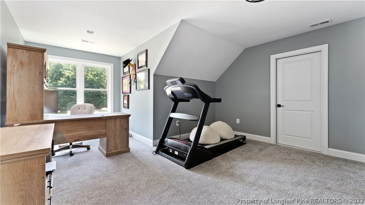 430 Mingo Church Road Dunn, NC 28334 - Photo 40 of 48 a room with gym equipment and a large window