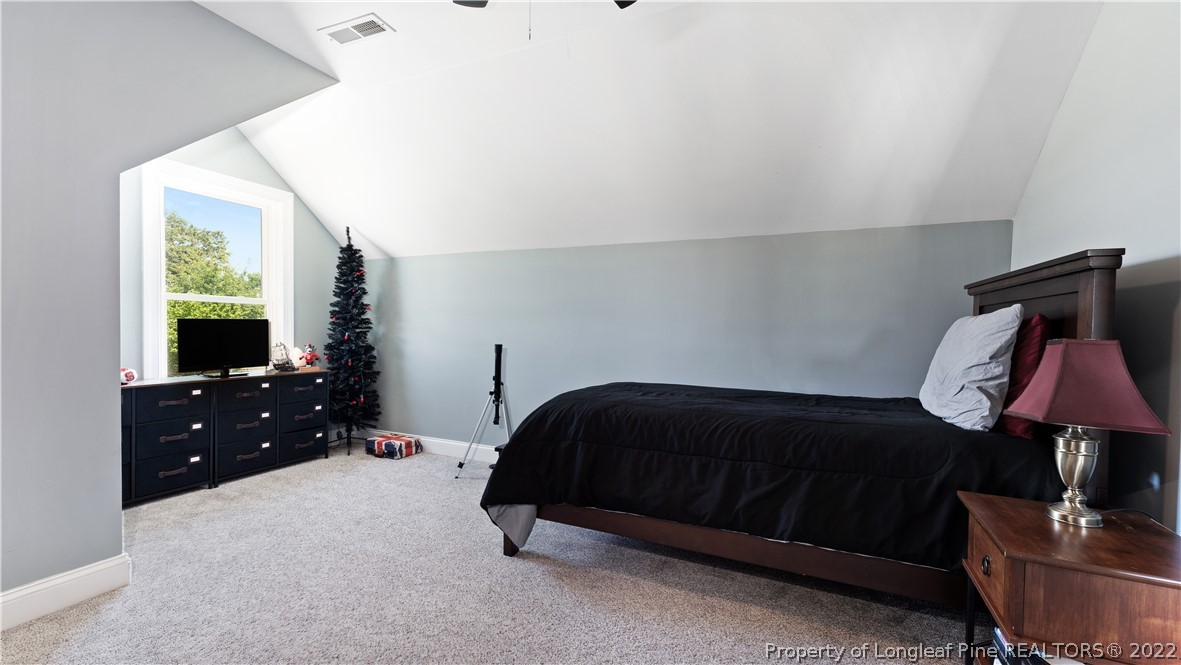 430 Mingo Church Road Dunn, NC 28334 - Photo 42 of 48 a bedroom with a bed and a window