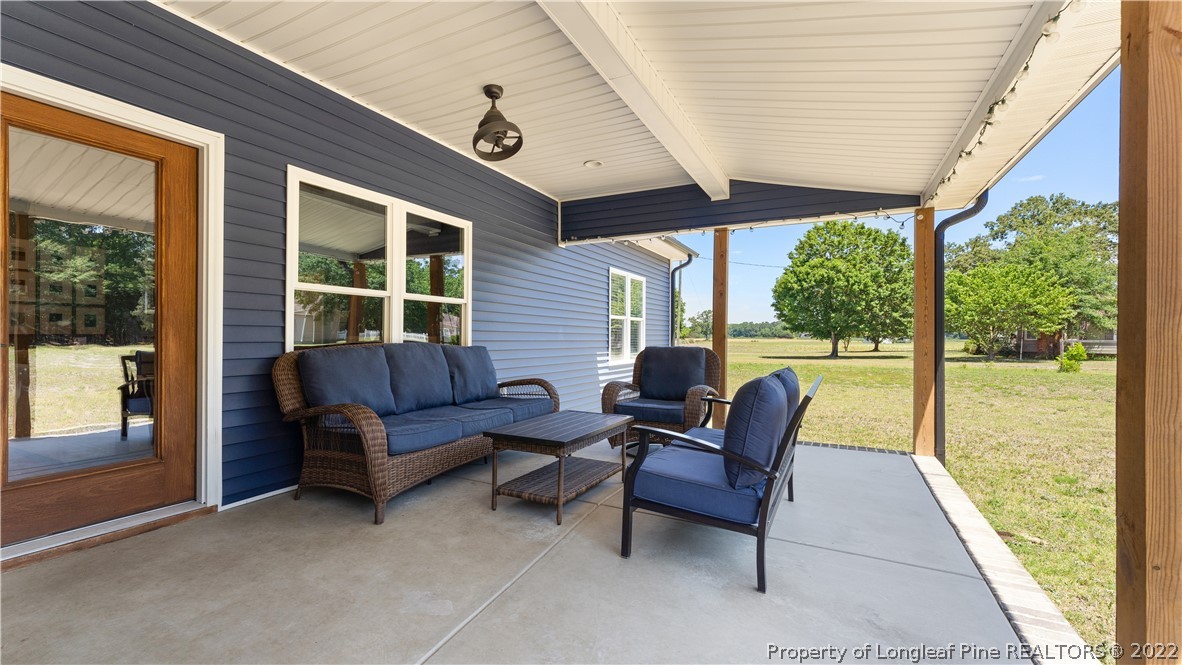 430 Mingo Church Road Dunn, NC 28334 - Photo 44 of 48 a outdoor living space with furniture and garden view