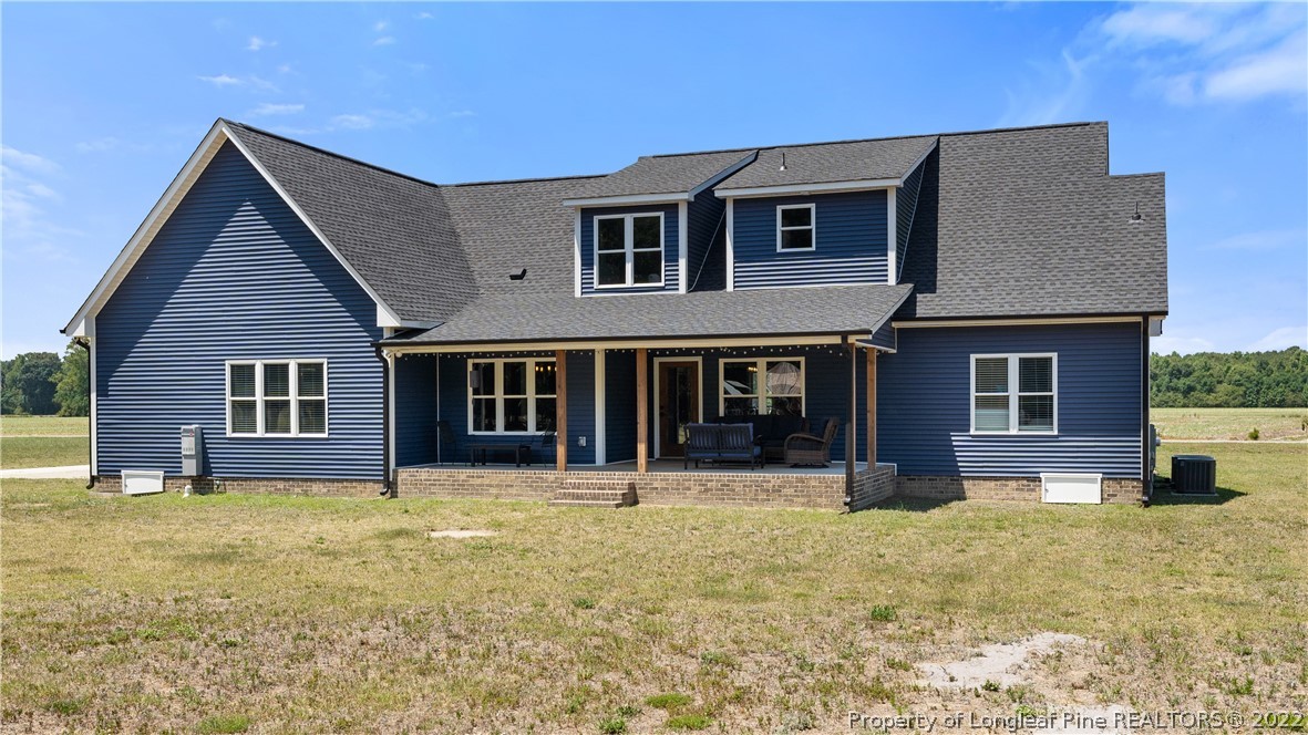 430 Mingo Church Road Dunn, NC 28334 - Photo 46 of 48 a house that has a lot of windows in it