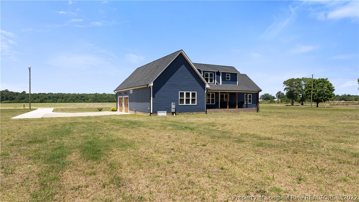 430 Mingo Church Road Dunn, NC 28334 - Photo 47 of 48 a front view of a house with a yard