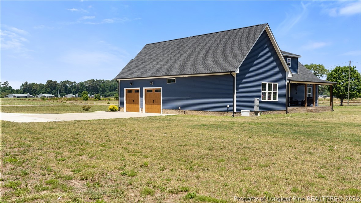 430 Mingo Church Road Dunn, NC 28334 - Photo 48 of 48 a view of a house with a yard