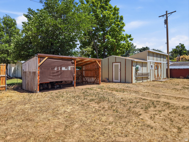 365 North Main Street Fillmore, UT 84631 - Photo 7 of 51 Detached outbuilding with a two-story design and a separate open-air carport
