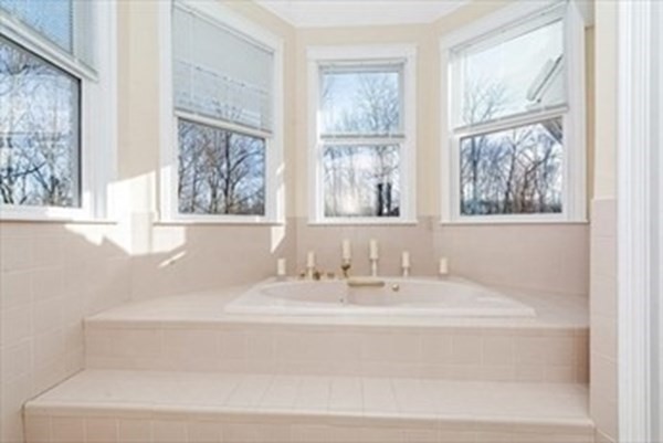 12 Hanson Lane Dracut, MA 01826 - Photo 13 of 23 a bathroom with bathtub and window