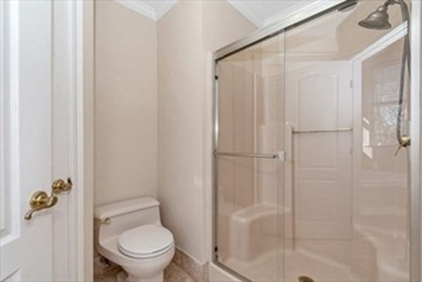 12 Hanson Lane Dracut, MA 01826 - Photo 14 of 23 a white toilet sitting next to a shower