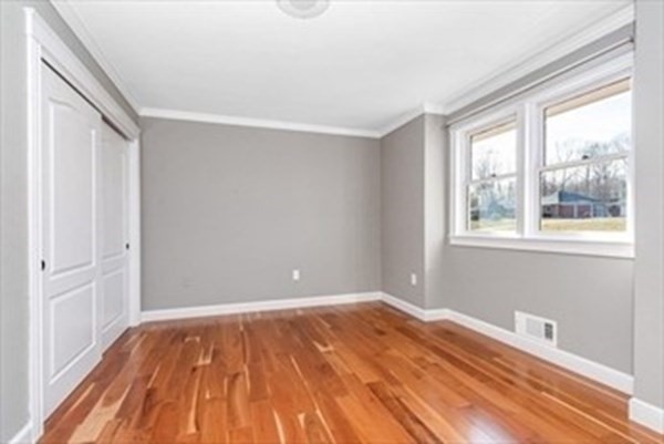 12 Hanson Lane Dracut, MA 01826 - Photo 16 of 23 a view of a room with wooden floor and natural light