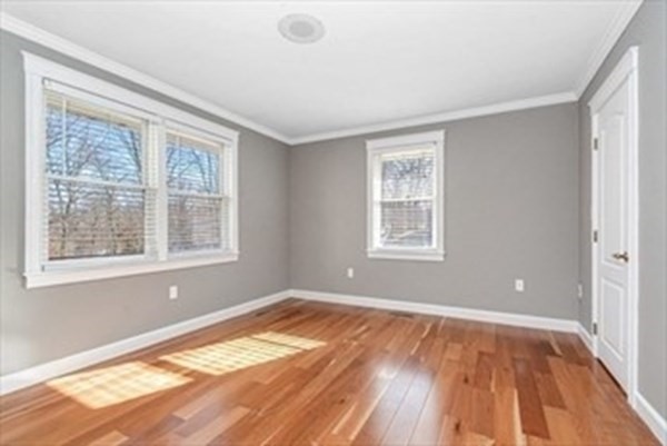 12 Hanson Lane Dracut, MA 01826 - Photo 17 of 23 a view of empty room with wooden floor and fan