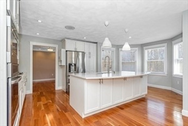 12 Hanson Lane Dracut, MA 01826 - Photo 6 of 23 a kitchen with stainless steel appliances a refrigerator and microwave