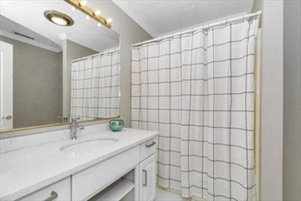 12 Hanson Lane Dracut, MA 01826 - Photo 10 of 23 a bathroom with a sink and a shower