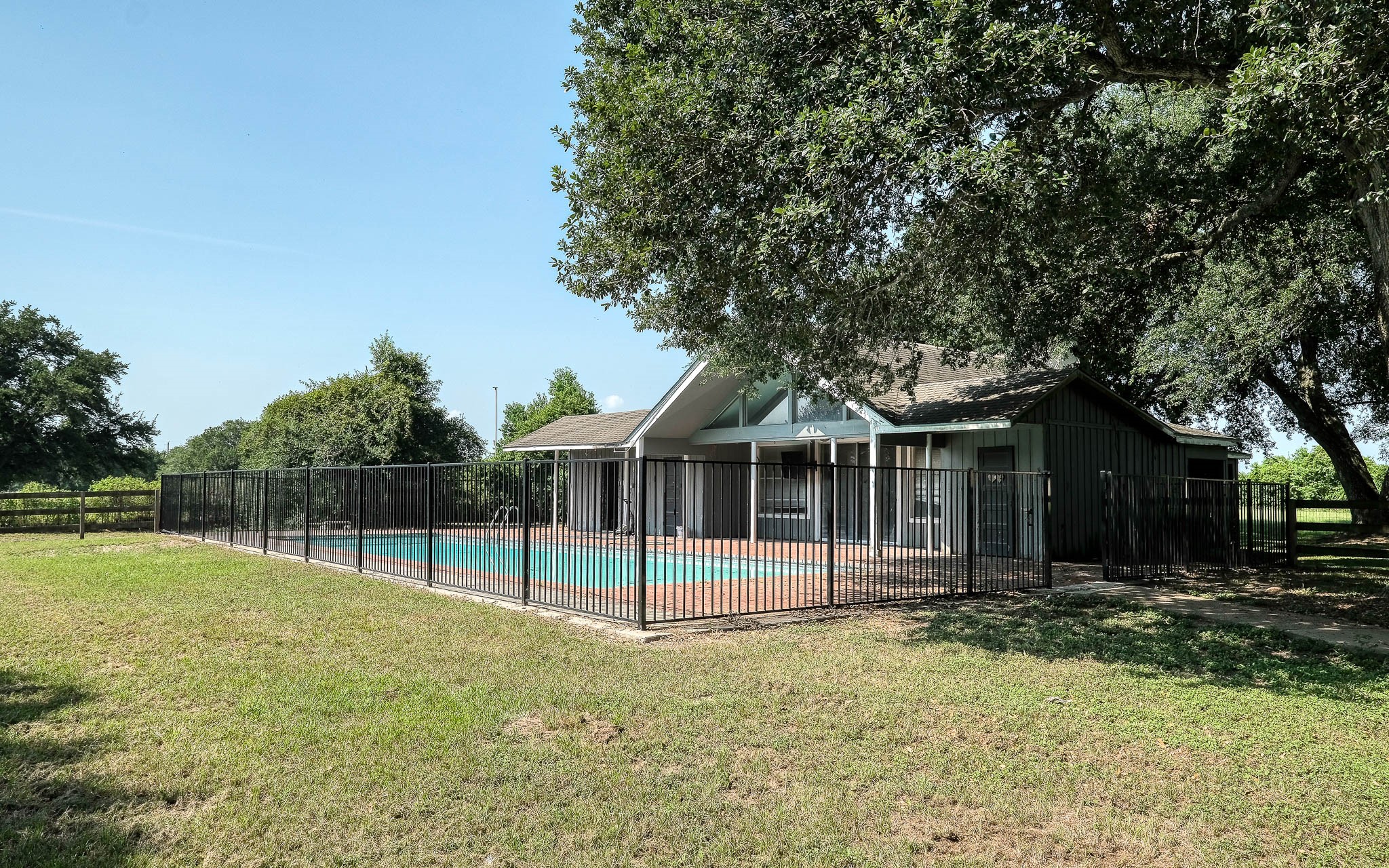 20515 Kickapoo Road Waller, TX 77484 - Photo 30 of 50 a view of a house with backyard and tree