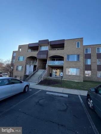 a view of a car parked in front of a building