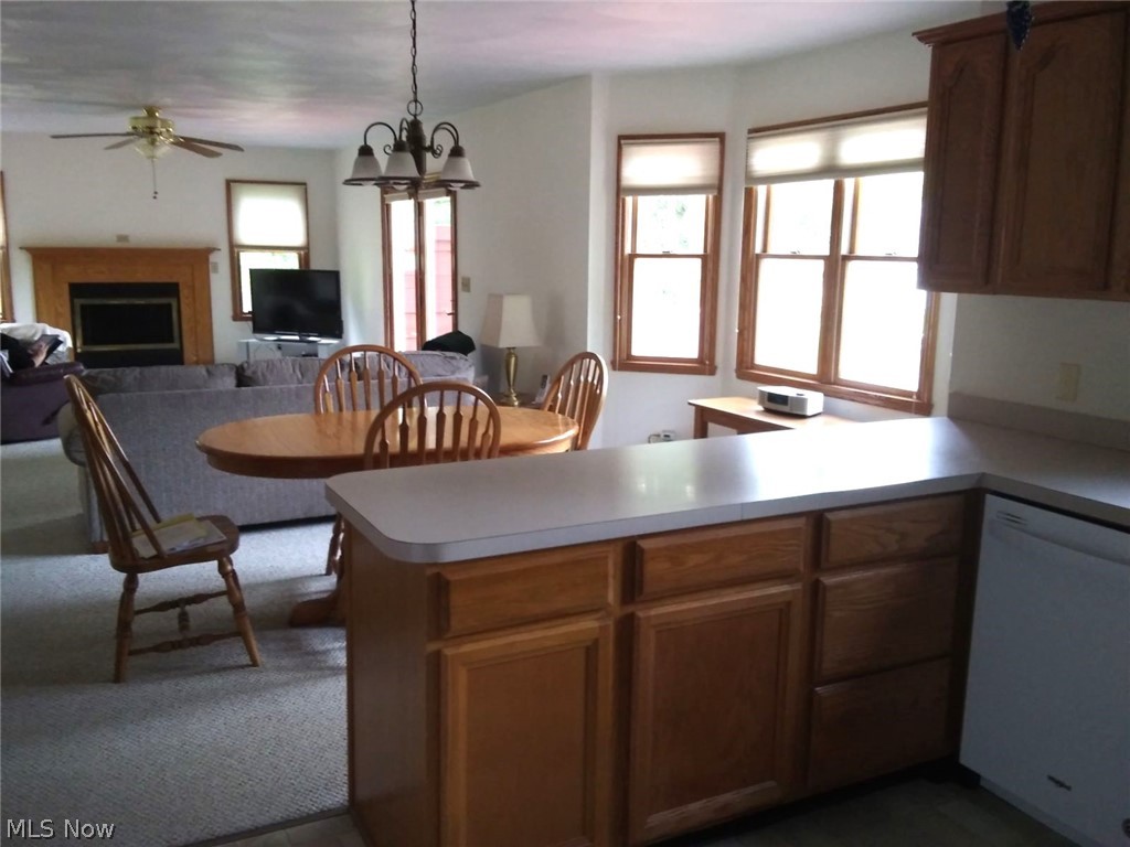 6861 South Raccoon Road Canfield, OH 44406 - Photo 14 of 41 Kitchen with natural oak cabinets, light countertops and newer luxury vinyl flooring