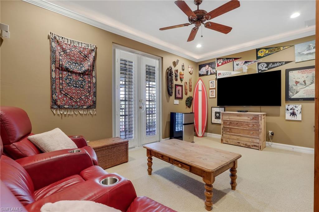 1859 Ivory Cane Point Naples, FL 34119 - Photo 25 of 50 Living room with french doors, carpet, crown molding, recessed lighting, and a ceiling fan