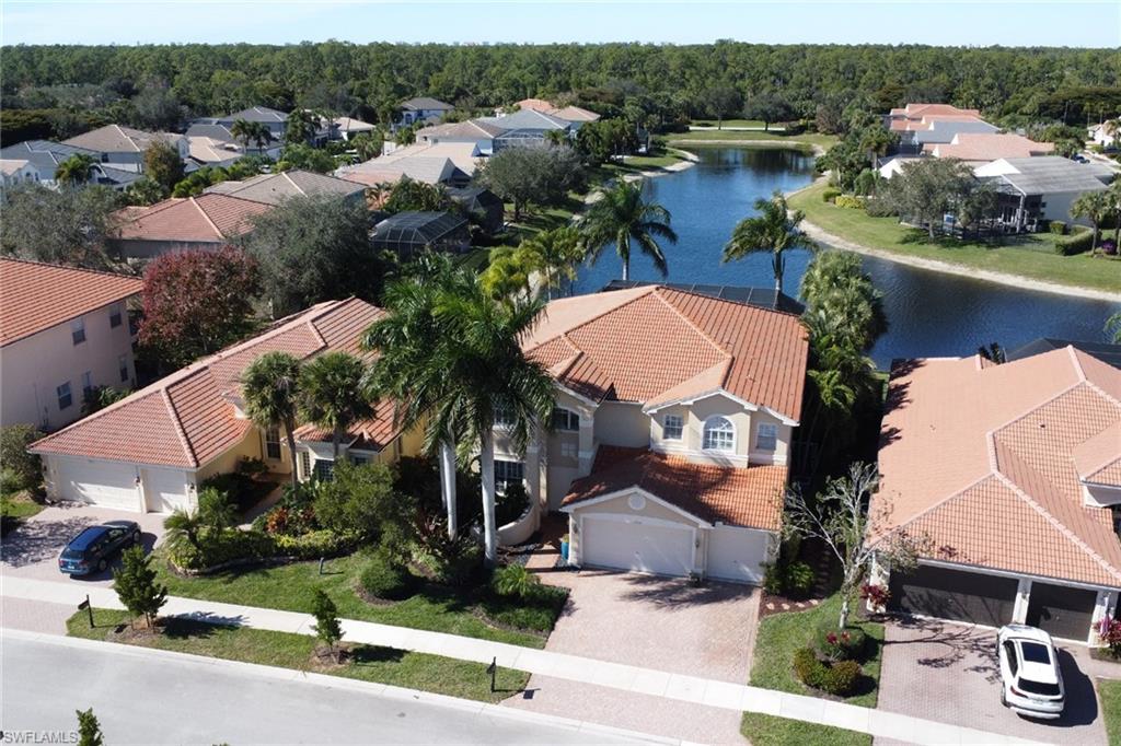 1859 Ivory Cane Point Naples, FL 34119 - Photo 4 of 50 Aerial view of residential area featuring a large body of water