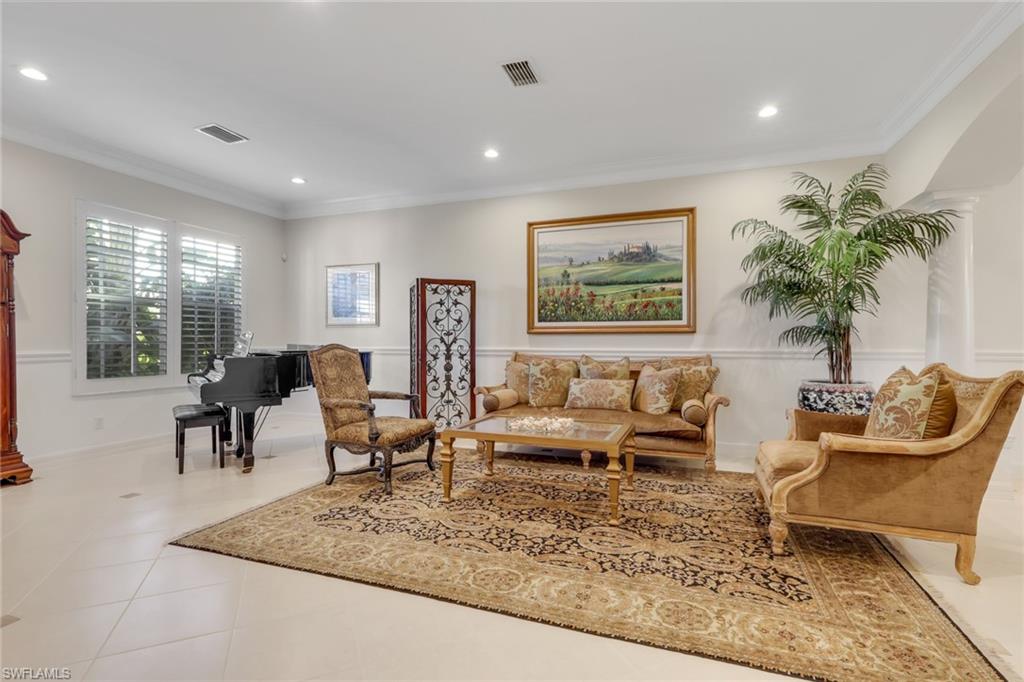 1859 Ivory Cane Point Naples, FL 34119 - Photo 6 of 50 Living room with ornamental molding, recessed lighting, and tile patterned floors