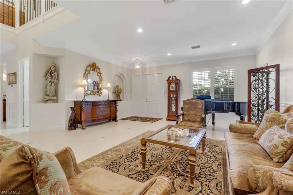 1859 Ivory Cane Point Naples, FL 34119 - Photo 9 of 50 Living room with recessed lighting and crown molding