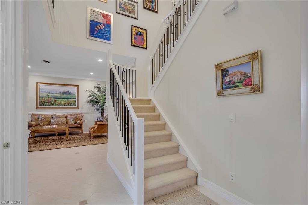 1859 Ivory Cane Point Naples, FL 34119 - Photo 10 of 50 Stairway featuring tile patterned floors and recessed lighting