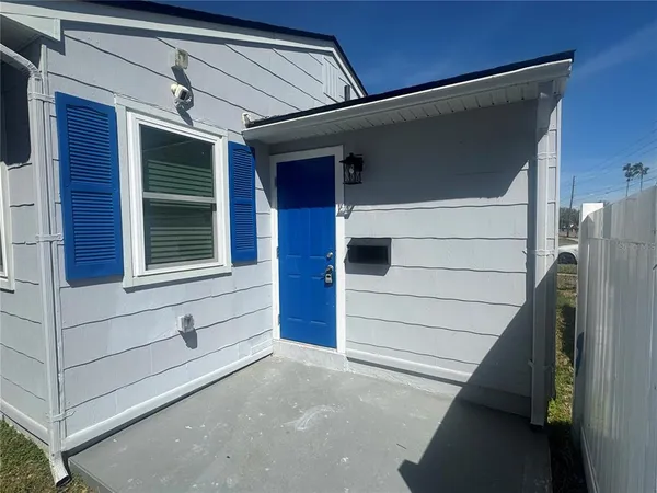 a view of front door and bedroom
