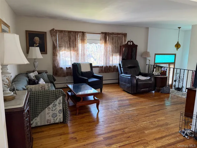 a living room with furniture rug and window