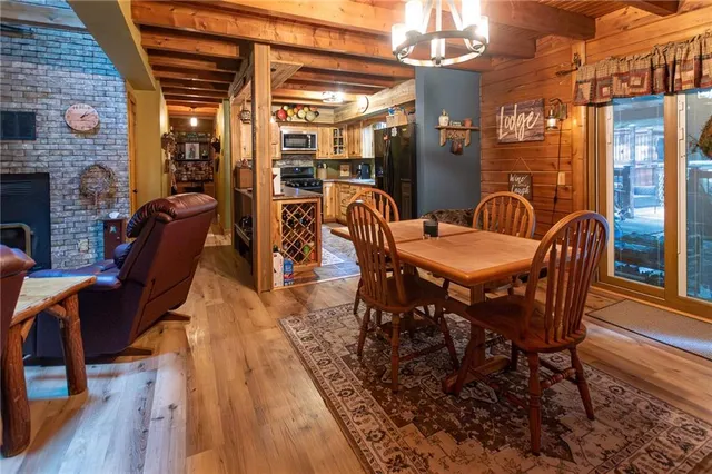 a dining room with furniture and wooden floor