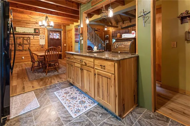 a kitchen with stainless steel appliances granite countertop a sink and cabinets