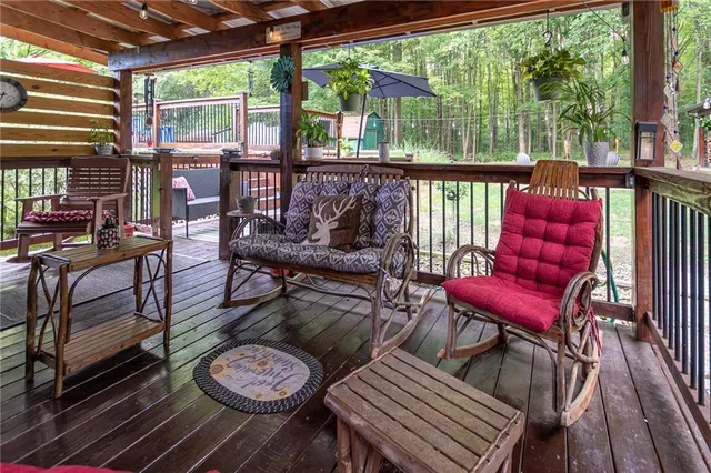 a view of a chairs and table in the patio