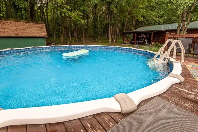 a view of swimming pool with a patio