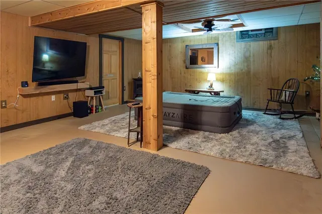 a room with furniture and flat screen tv