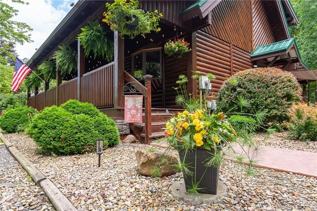 a white vase with flowers