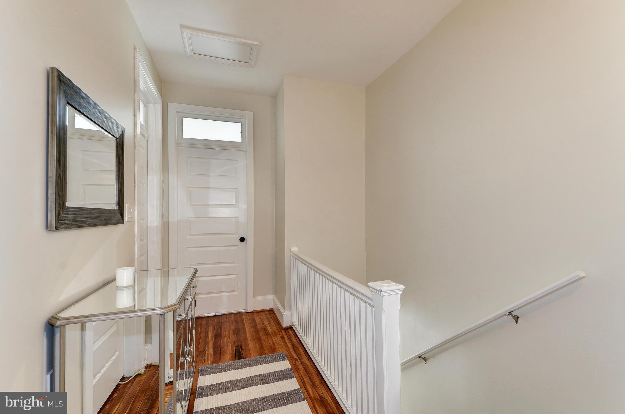 809 Jefferson Street Northwest Washington, DC 20011 - Photo 13 of 26 a view of a hallway with wooden floor and staircase