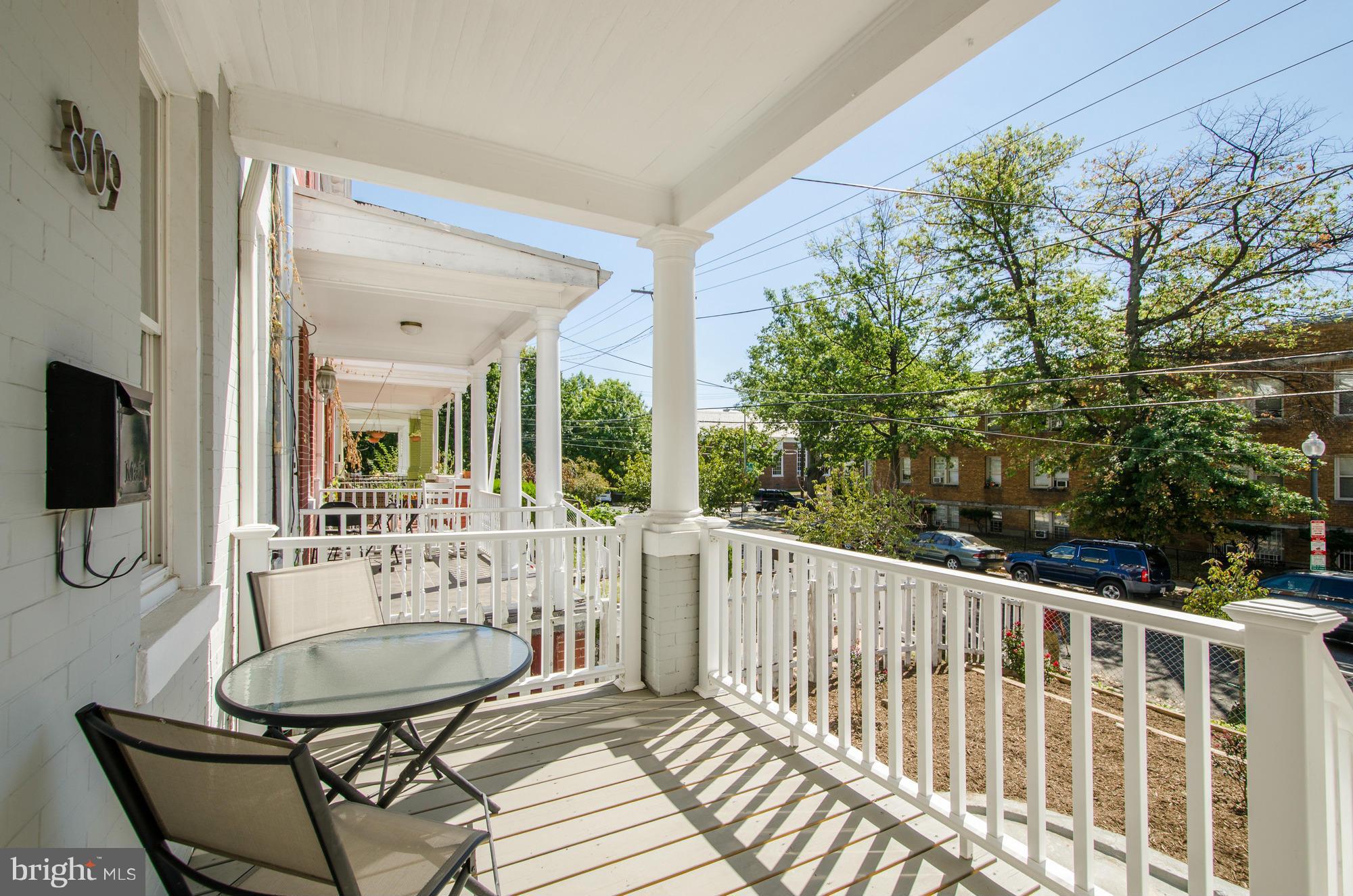 809 Jefferson Street Northwest Washington, DC 20011 - Photo 3 of 26 a view of a balcony with a table and chairs
