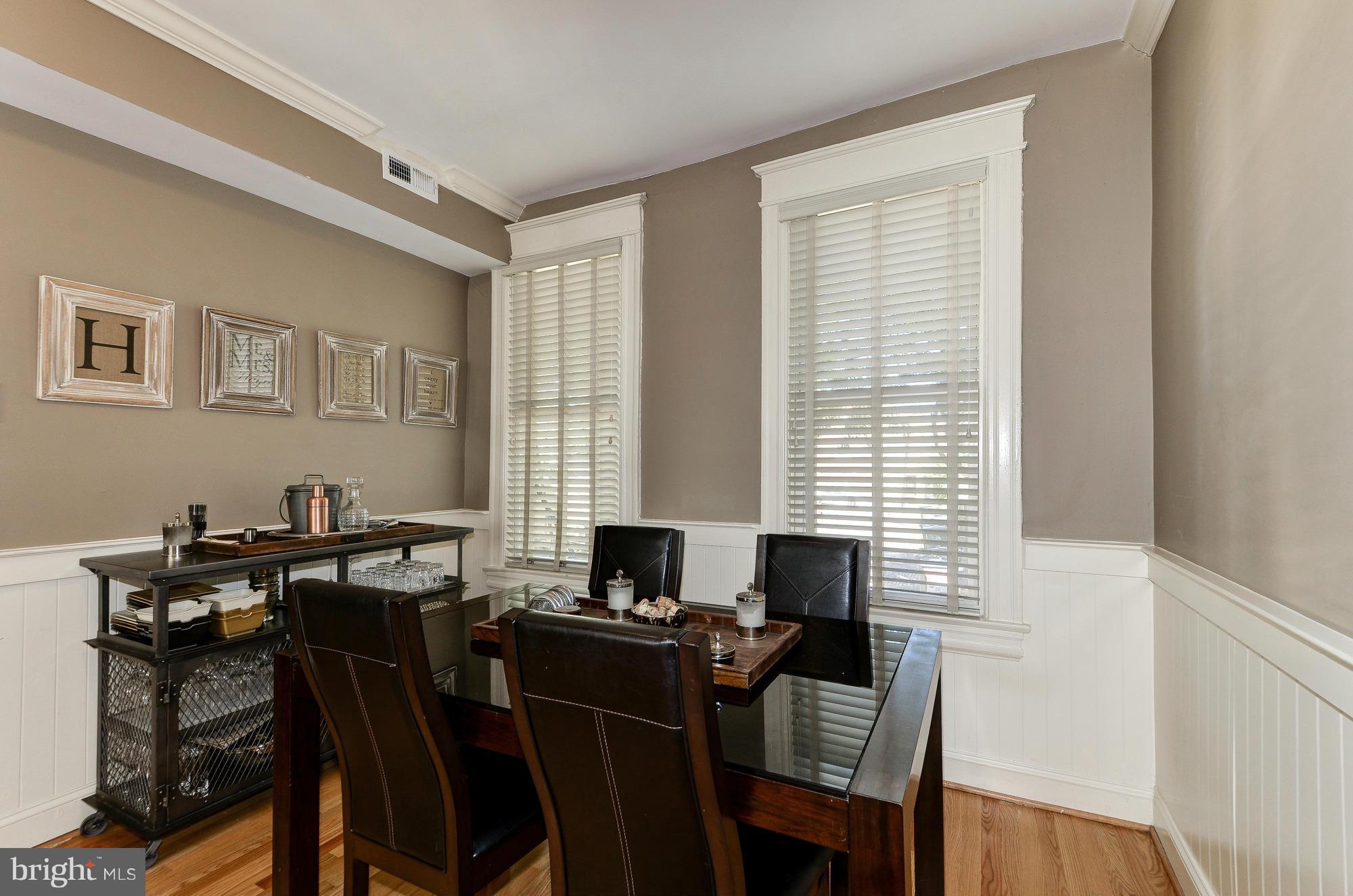 809 Jefferson Street Northwest Washington, DC 20011 - Photo 9 of 26 a view of a a dining room with furniture window and wooden floor