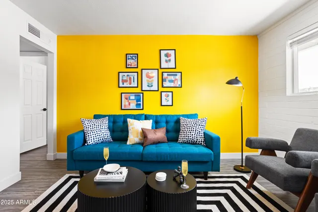 a living room with furniture and a window