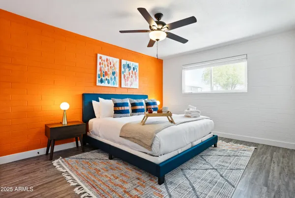 a bedroom with a bed and a window