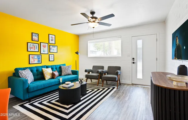 a living room with furniture and a table