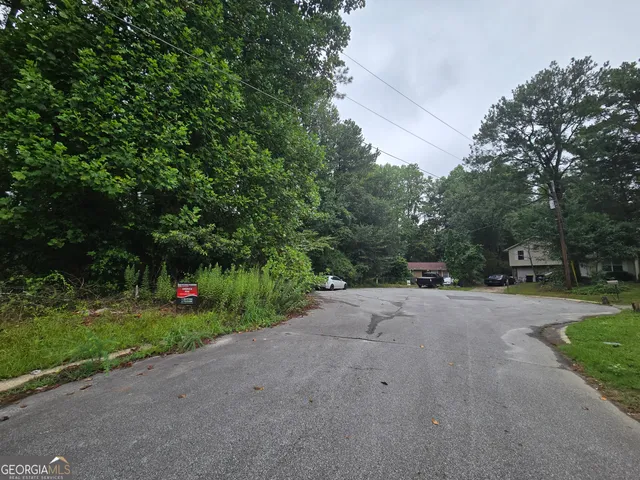 a view of a street with a trees